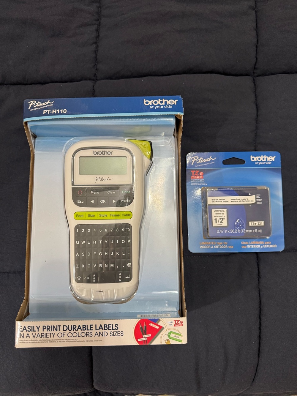 Brother handheld label maker box in blue with white and black accents.